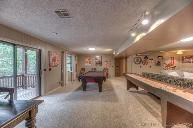 game room with pool table, a textured ceiling, track lighting, and carpet floors