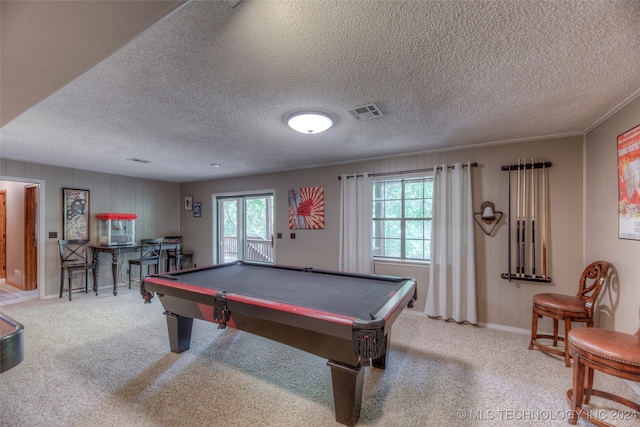 rec room featuring a textured ceiling, a healthy amount of sunlight, ornamental molding, and billiards