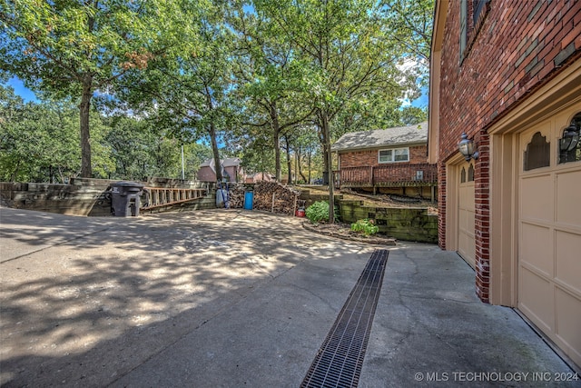 view of patio / terrace featuring a garage