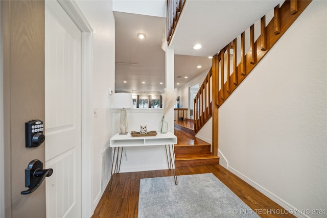 entrance foyer with dark hardwood / wood-style flooring