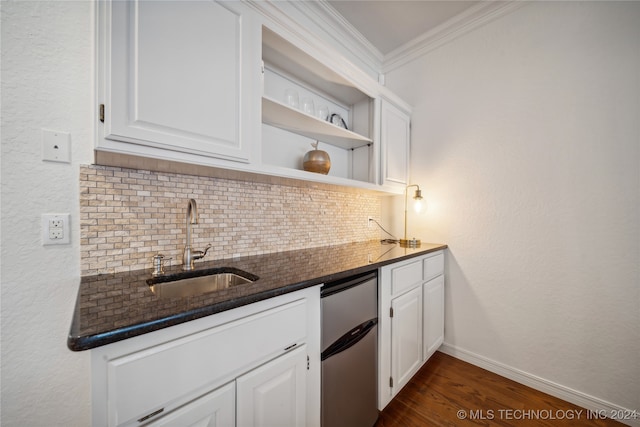 kitchen with white cabinetry, stainless steel refrigerator, dark hardwood / wood-style floors, dark stone countertops, and decorative backsplash