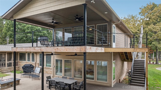 back of property with a patio and ceiling fan