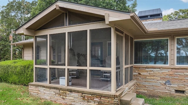 view of home's exterior featuring a sunroom