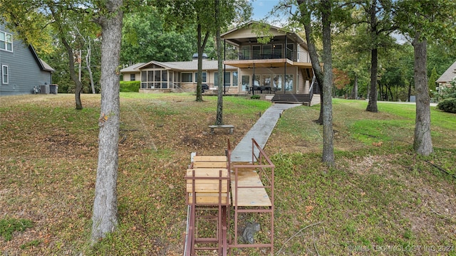 exterior space featuring a sunroom