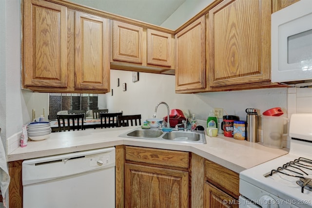 kitchen featuring sink and white appliances