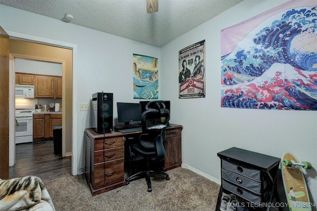 office space with a textured ceiling and dark hardwood / wood-style flooring