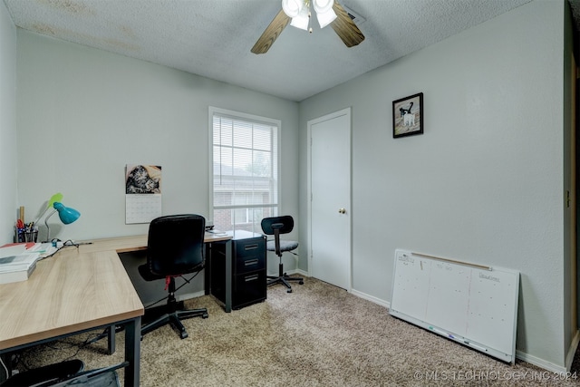 office with ceiling fan, a textured ceiling, and light carpet