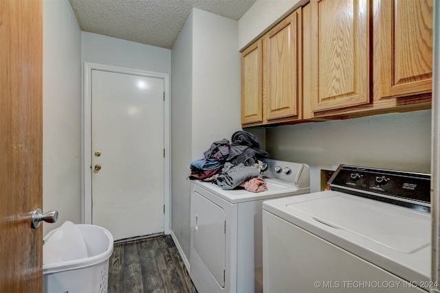 laundry area with cabinets, a textured ceiling, independent washer and dryer, and dark hardwood / wood-style flooring