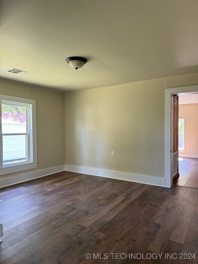 empty room featuring dark wood-type flooring