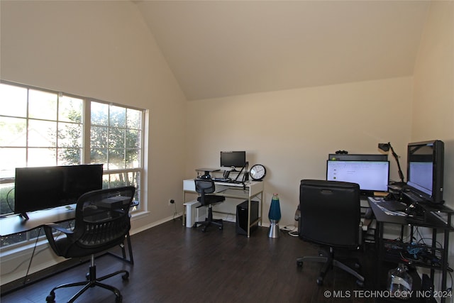 home office featuring dark wood-type flooring and high vaulted ceiling