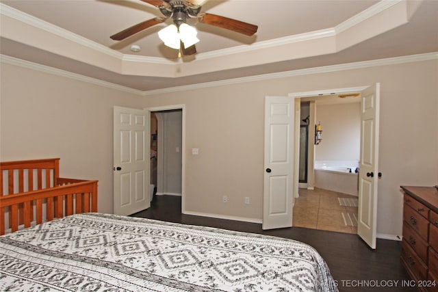 bedroom featuring ornamental molding, ceiling fan, a raised ceiling, and dark hardwood / wood-style flooring