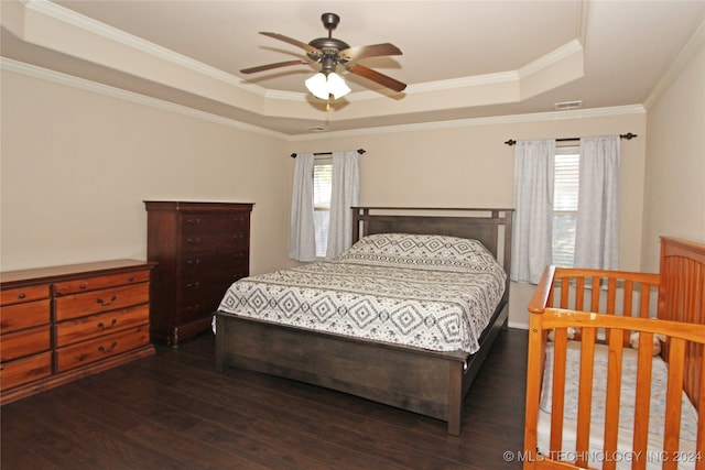 bedroom with ceiling fan, crown molding, dark hardwood / wood-style flooring, and multiple windows