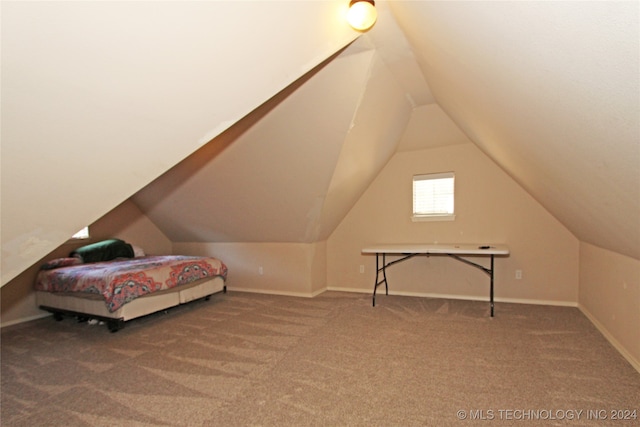 bedroom featuring carpet floors and lofted ceiling