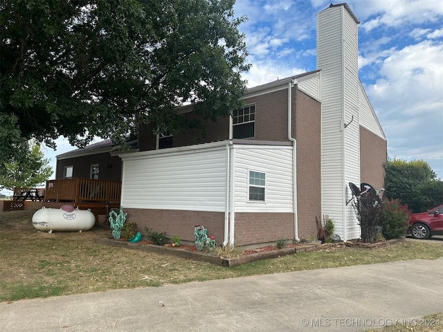 view of side of property featuring a deck