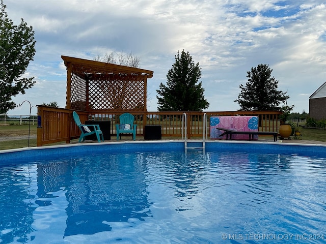 view of swimming pool with a patio