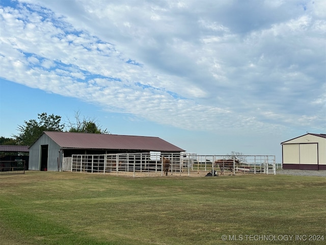 view of horse barn featuring a rural view