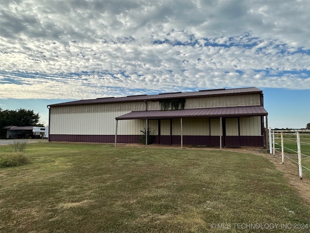 view of outbuilding with a lawn