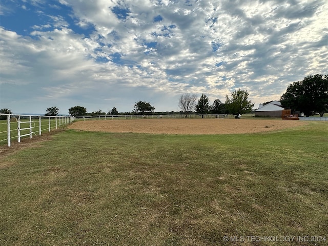 view of yard with a rural view