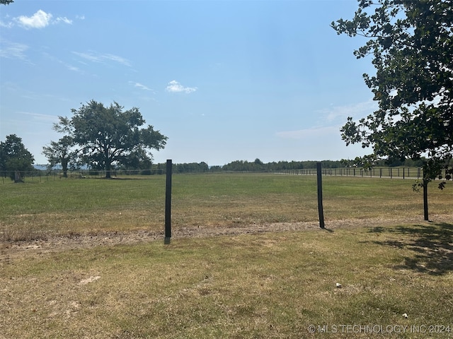 view of yard with a rural view