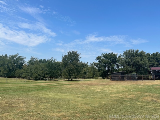 view of yard with a rural view