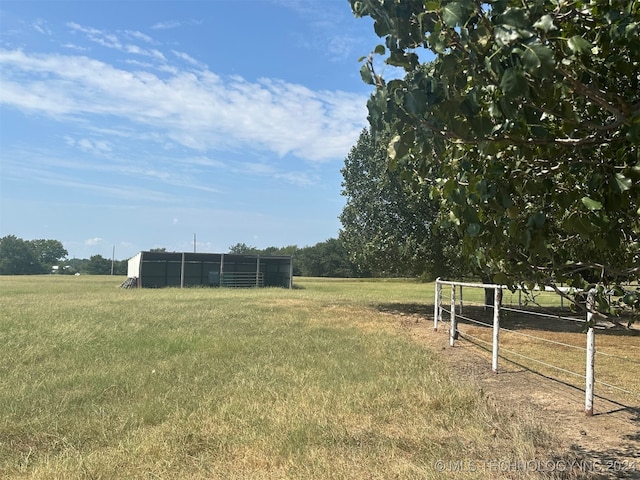 view of yard with a rural view