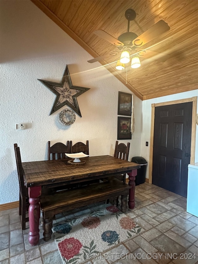 dining room with wood ceiling, vaulted ceiling, and ceiling fan