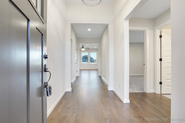 hall with wood-type flooring