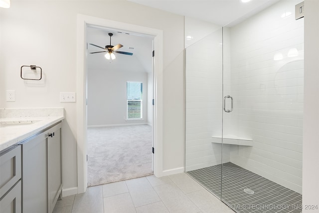 bathroom featuring vanity, ceiling fan, tile patterned floors, and a shower with shower door