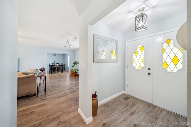 foyer entrance with hardwood / wood-style flooring