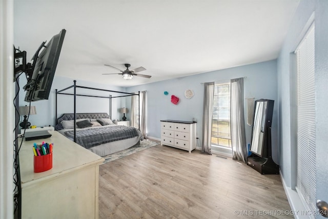 bedroom featuring ceiling fan and light hardwood / wood-style floors