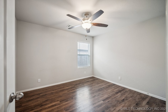 spare room with ceiling fan and dark hardwood / wood-style floors