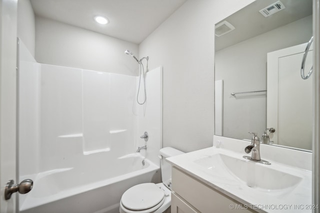 full bathroom featuring bathing tub / shower combination, vanity, and toilet