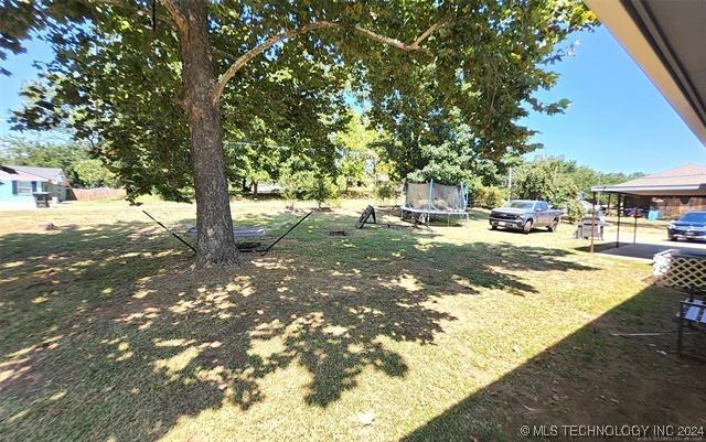 view of yard with a trampoline