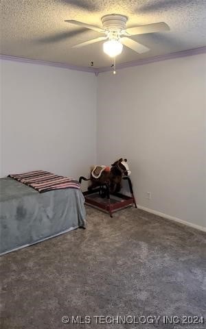 unfurnished bedroom with ceiling fan, a textured ceiling, and carpet