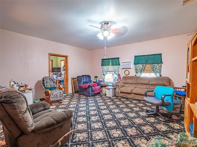 living room with ceiling fan, a textured ceiling, and a wall mounted AC