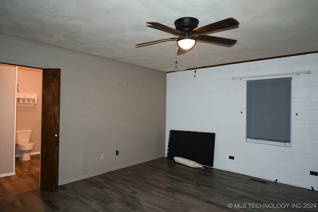 unfurnished living room with ceiling fan and dark hardwood / wood-style flooring