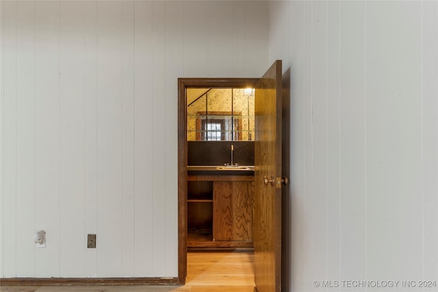 details with wood finished floors and a sink