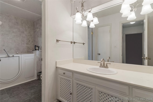 bathroom featuring a chandelier and vanity