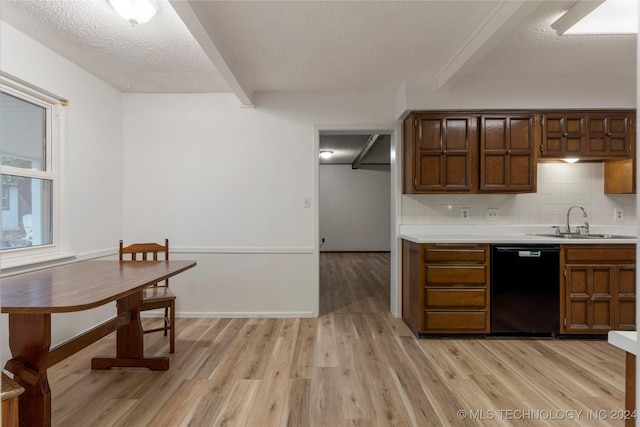 kitchen featuring sink, black dishwasher, tasteful backsplash, beamed ceiling, and light hardwood / wood-style floors