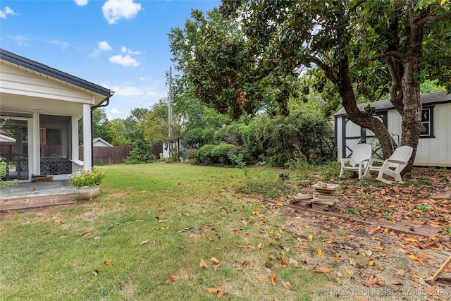 view of yard featuring a sunroom