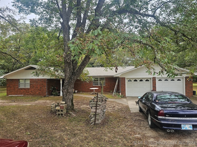 ranch-style home with a garage