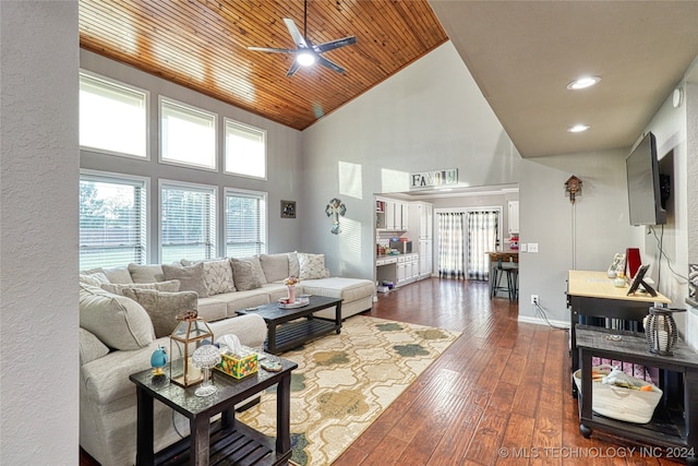 living room with high vaulted ceiling, ceiling fan, dark wood-type flooring, and a healthy amount of sunlight