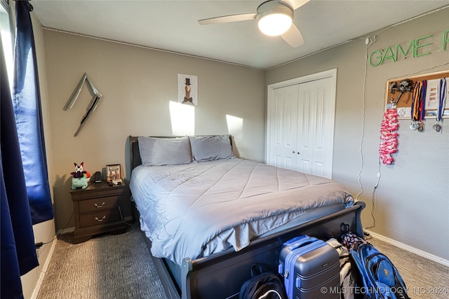 carpeted bedroom featuring a closet and ceiling fan