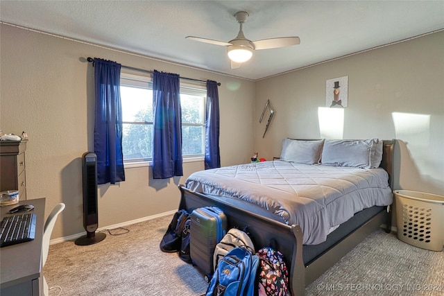 bedroom with ceiling fan and carpet