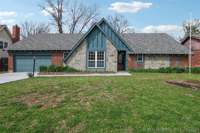 view of front of home featuring a garage and a front yard