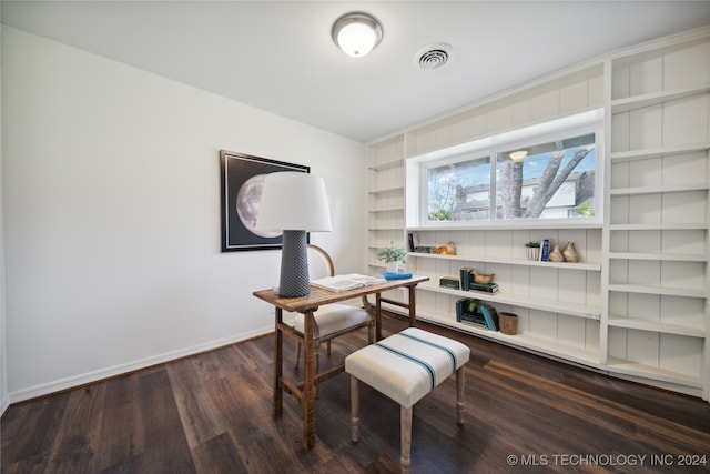 office area featuring built in shelves and dark hardwood / wood-style floors