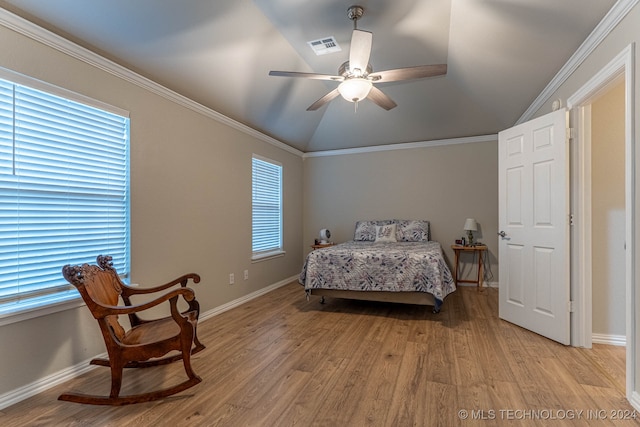 bedroom with ornamental molding, lofted ceiling, ceiling fan, and light hardwood / wood-style floors