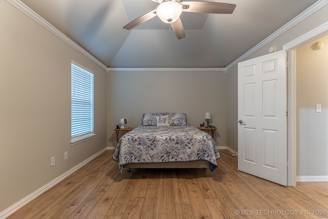 bedroom with ceiling fan, ornamental molding, light wood-type flooring, and vaulted ceiling