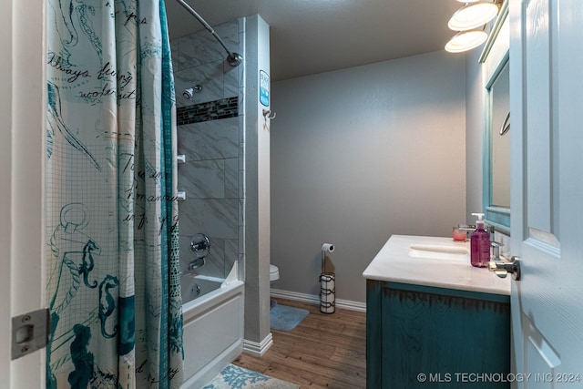 full bathroom with shower / bath combination with curtain, vanity, toilet, and hardwood / wood-style flooring