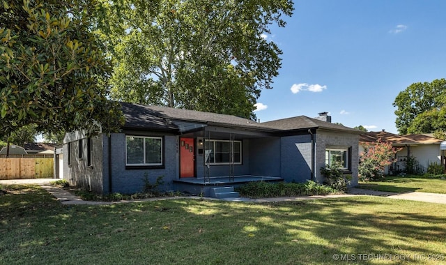 ranch-style house featuring a front lawn